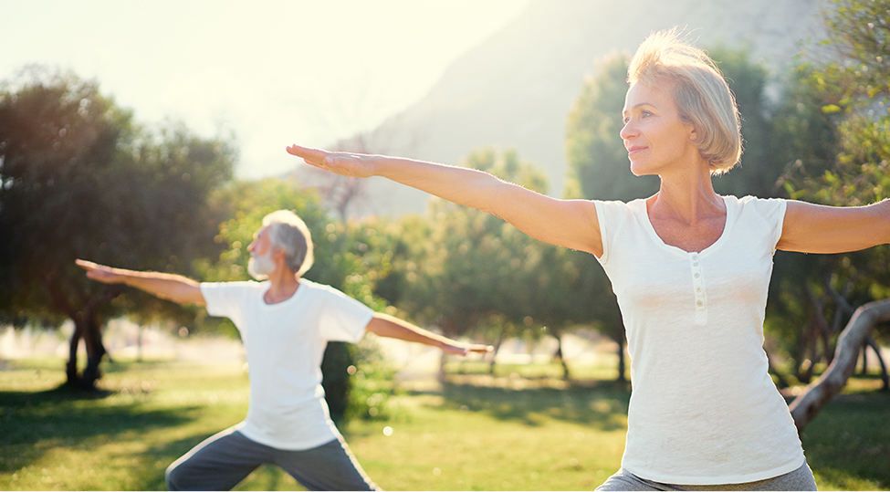 Men and women doing yoga