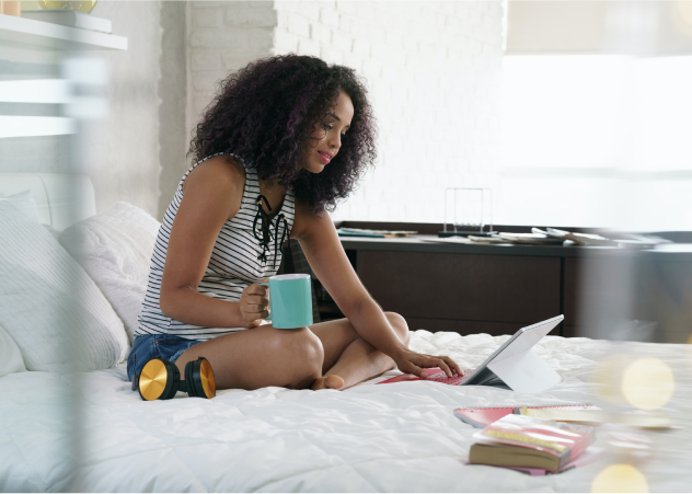 Women working on laptop with coffee in her hands